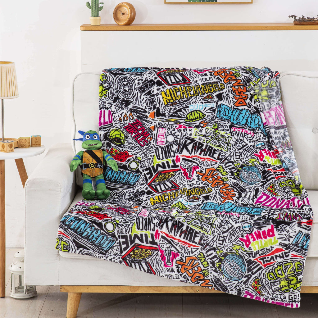 Decorative Knitted Teenage Mutant Tutles Sketched Out Kids Silk Touch Throw Blanket with Plush Hugger – Ultra Soft Plush Character Pillo... - Super Soft Reversible Sherpa Flannel Blanket Detail