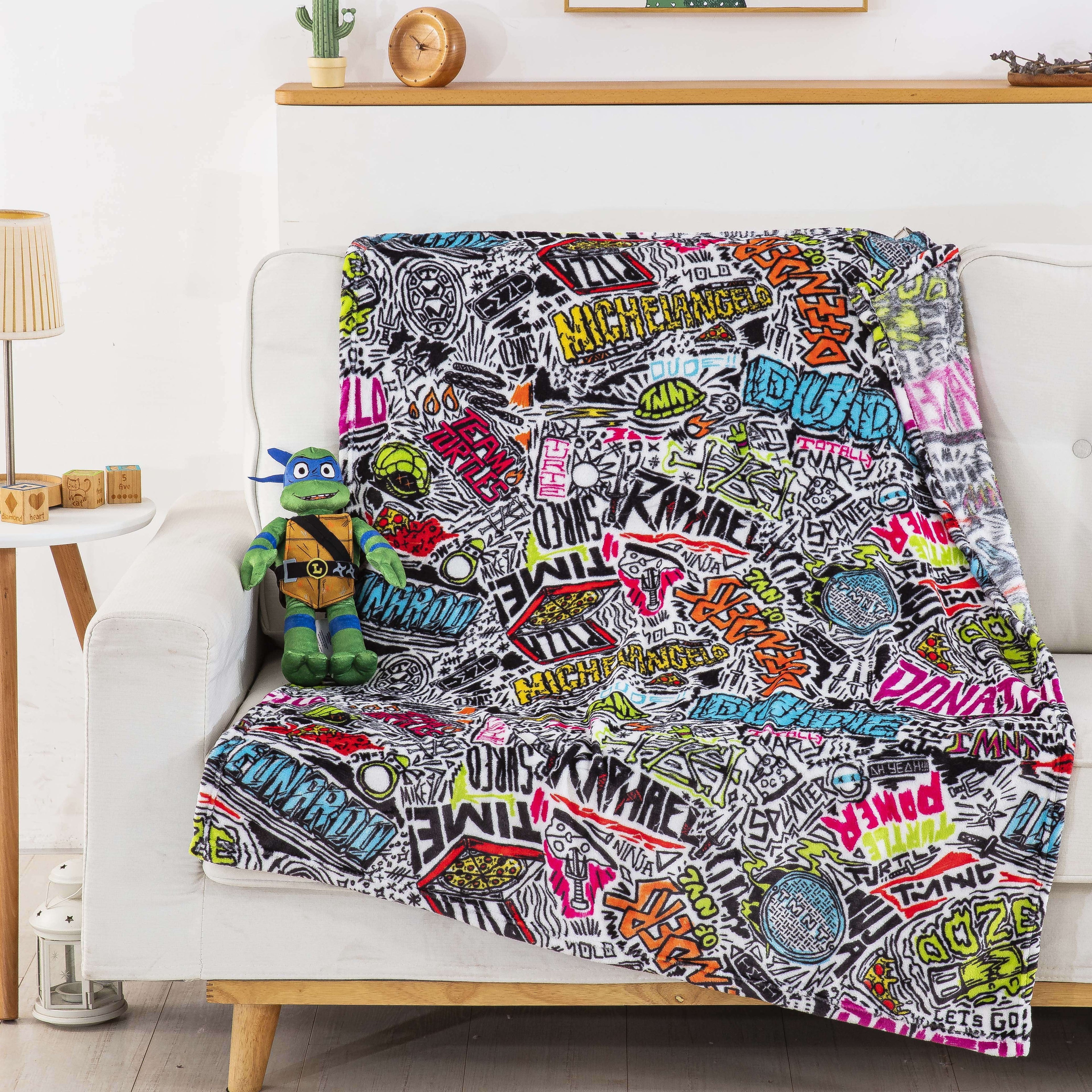 Decorative Knitted Teenage Mutant Tutles Sketched Out Kids Silk Touch Throw Blanket with Plush Hugger – Ultra Soft Plush Character Pillo... - Super Soft Reversible Sherpa Flannel Blanket Detail